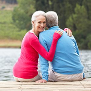 Elderly couple sitting on a dock